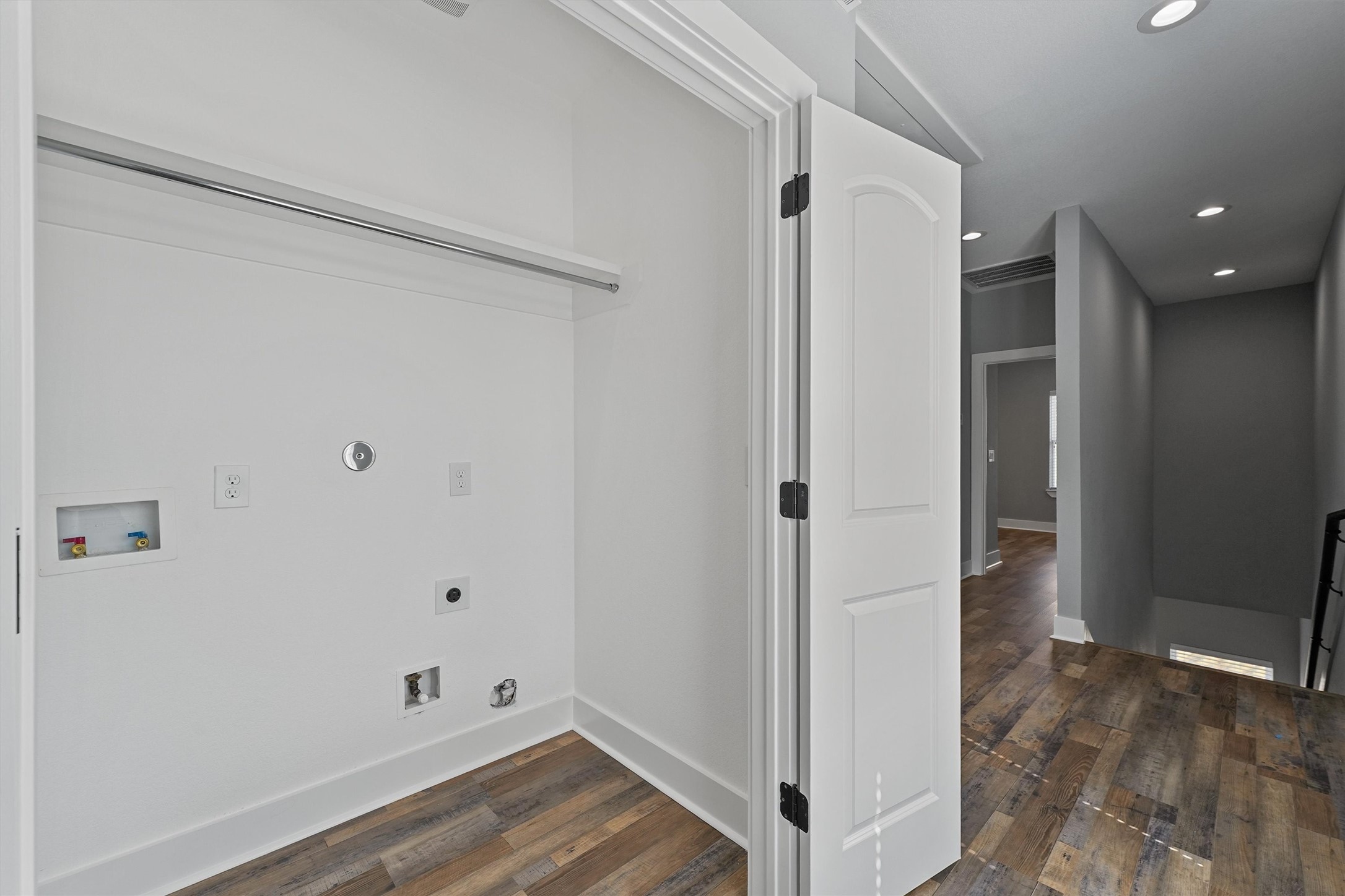 7704 Sealey Street Houston, TX 77088 - Photo 13 of 15 a view of room with walk in closet and wooden floor