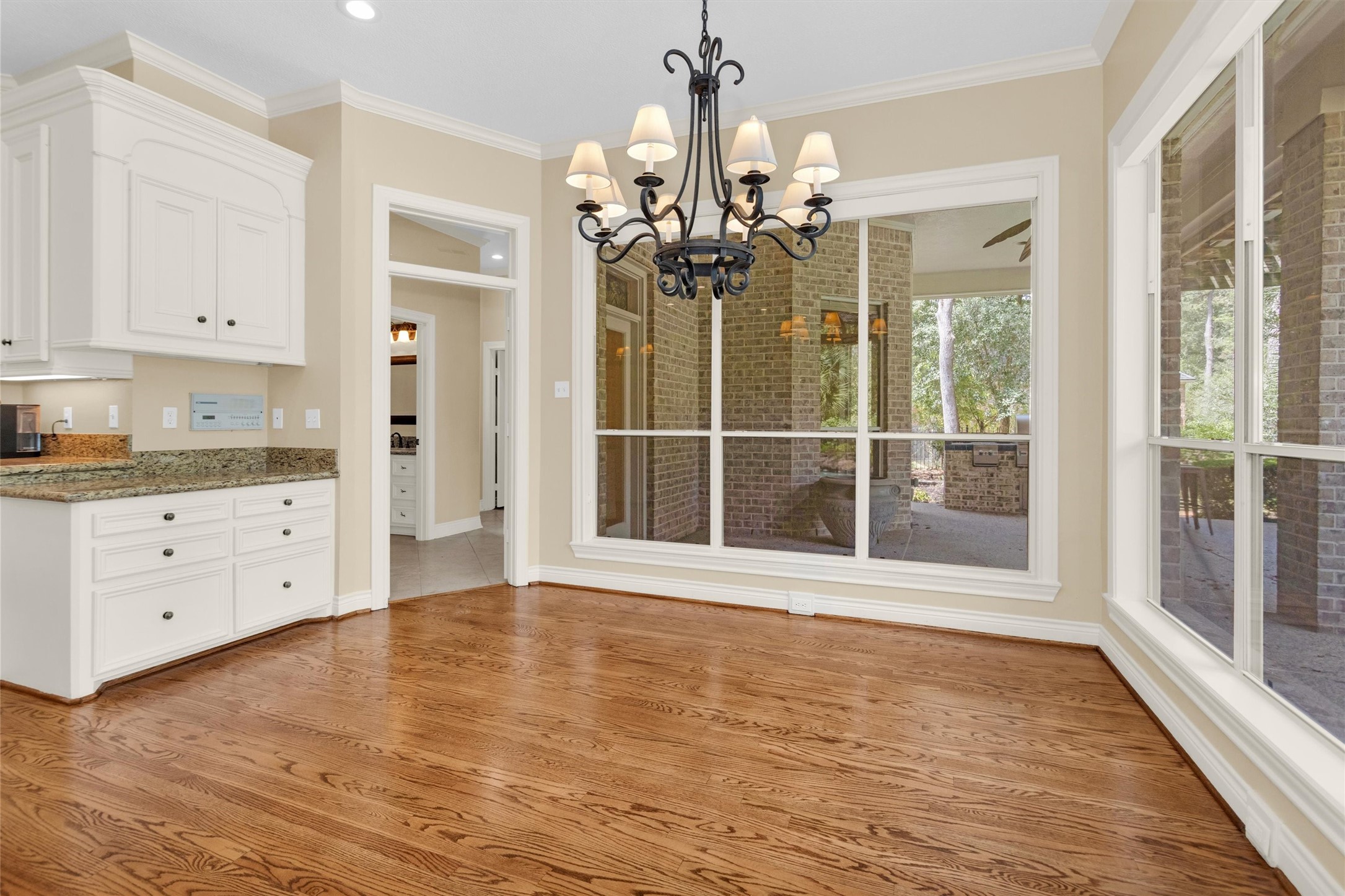 263 Saddle Ridge Spring, TX 77380 - Photo 22 of 50 Breakfast Room with windows overlooking the Outdoor Kitchen and Pool.
