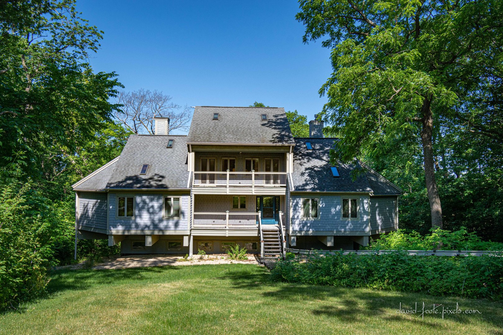 18 Lookout Trace Galena, IL 61036 - Photo 2 of 56 a view of a house with a big yard and large trees
