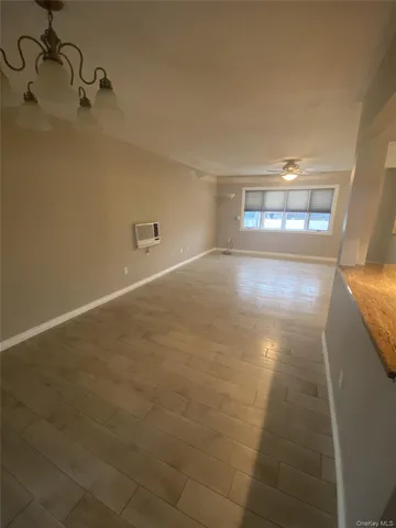 a view of a big room with windows