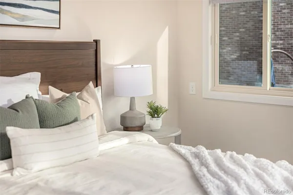 a bedroom with a bed and window