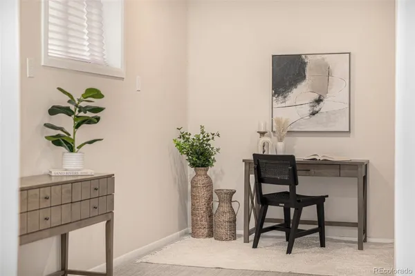 a view of a workspace with furniture