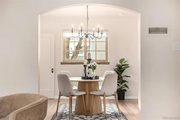 a dining room with furniture and window
