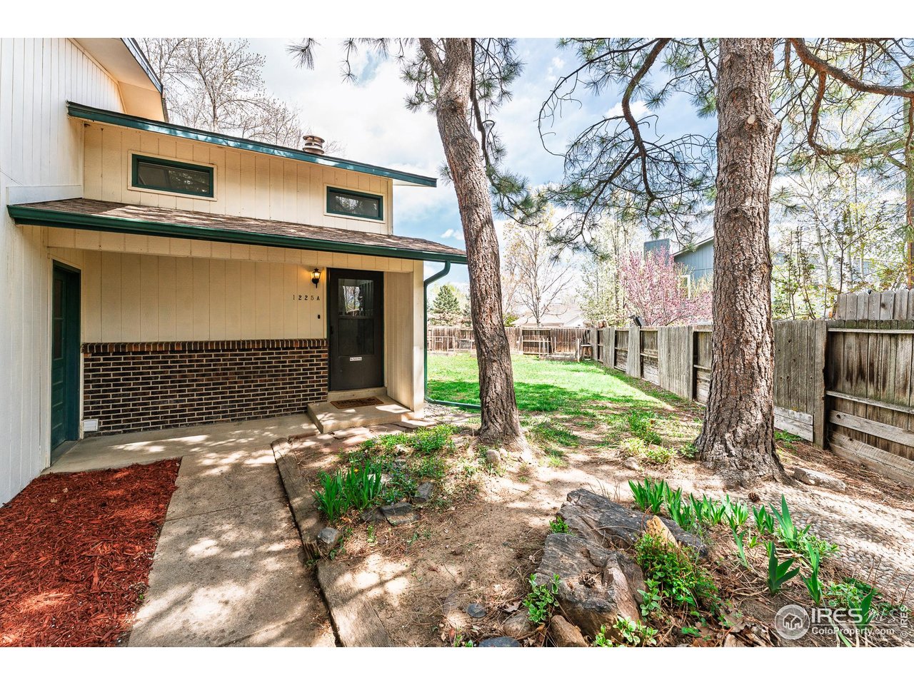 a backyard of a house with lots of green space