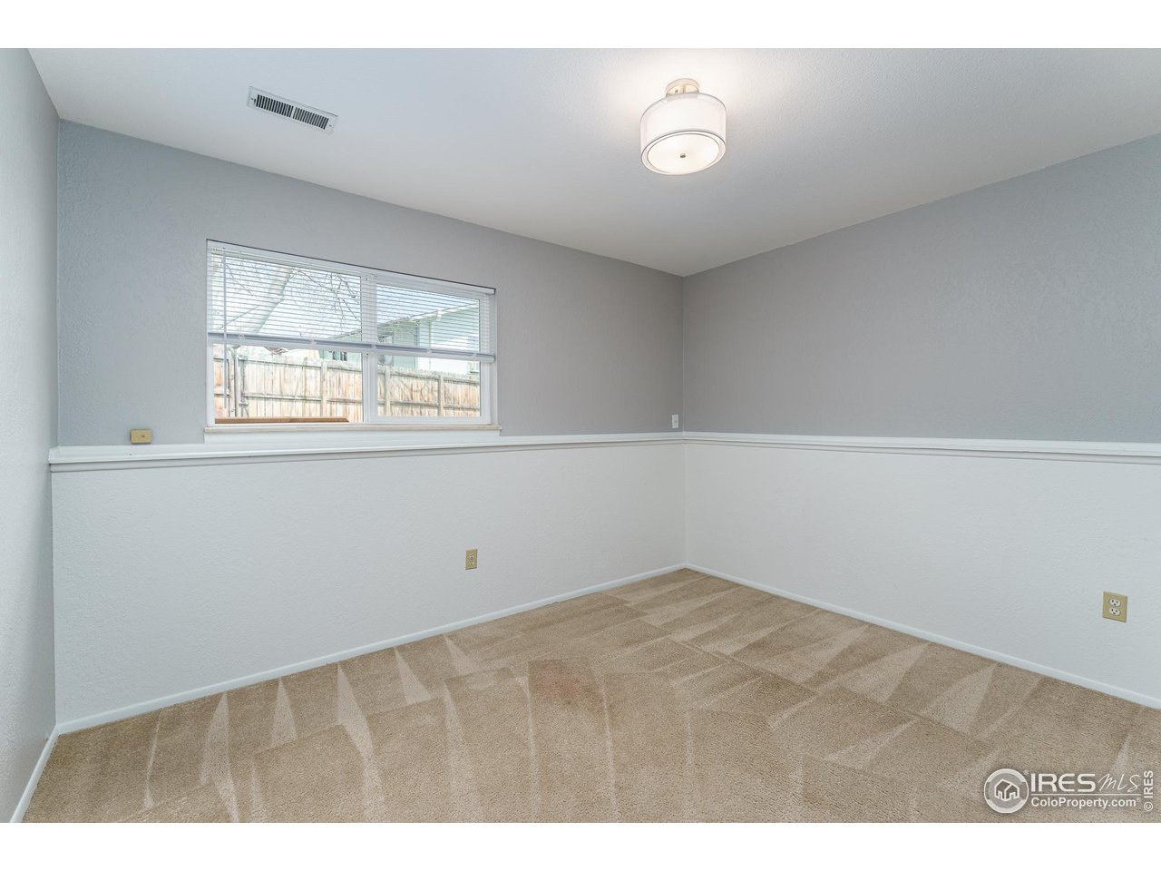 1225 Centaur Circle, Unit A Lafayette, CO 80026 - Photo 15 of 35 a view of an empty room with a window