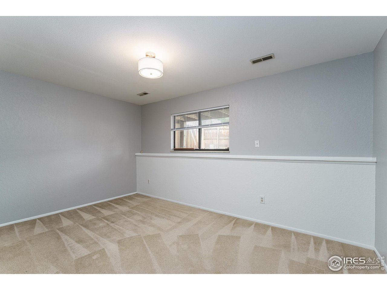 1225 Centaur Circle, Unit A Lafayette, CO 80026 - Photo 18 of 35 a view of an empty room with a window