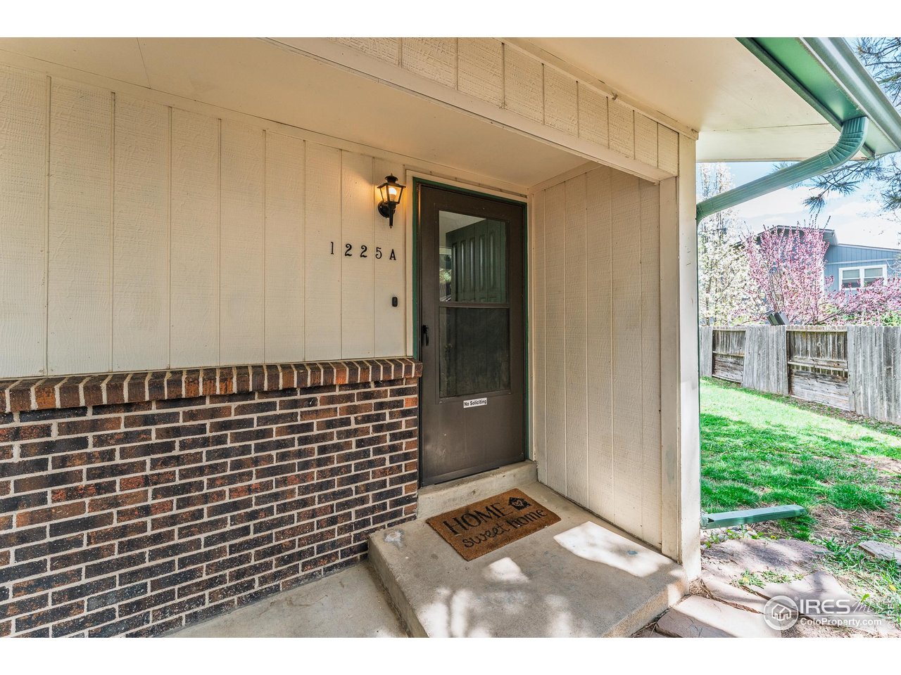 1225 Centaur Circle, Unit A Lafayette, CO 80026 - Photo 23 of 35 a view of a door and a street