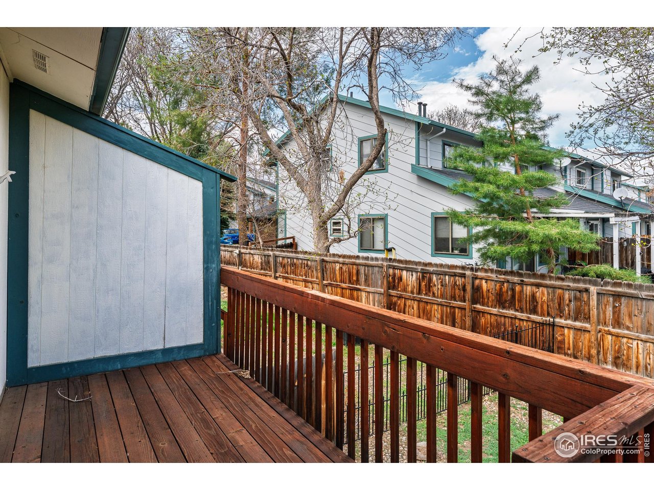 1225 Centaur Circle, Unit A Lafayette, CO 80026 - Photo 29 of 35 a view of a brick house with large windows