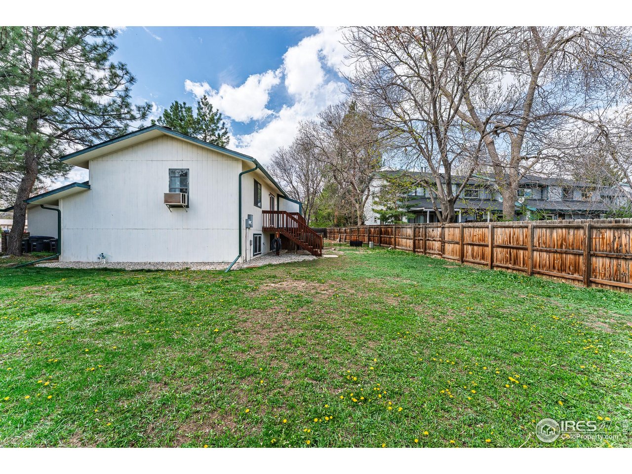 1225 Centaur Circle, Unit A Lafayette, CO 80026 - Photo 30 of 35 a view of a backyard with a garden