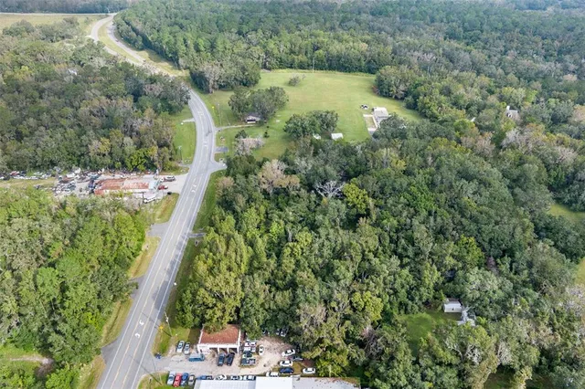 an aerial view of residential house with outdoor space