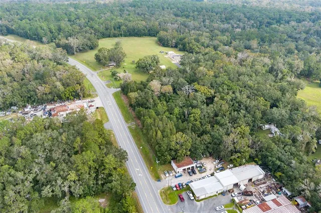 an aerial view of residential house with outdoor space