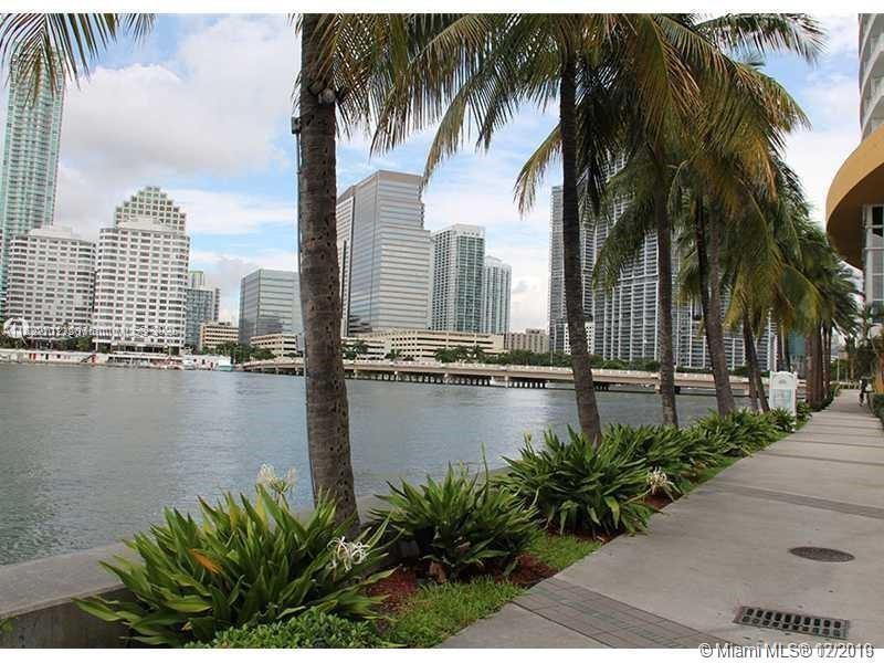 90 Southwest 3rd Street, Unit 3010 Miami, FL 33130 - Photo 19 of 44 a view of a lake with a palm tree