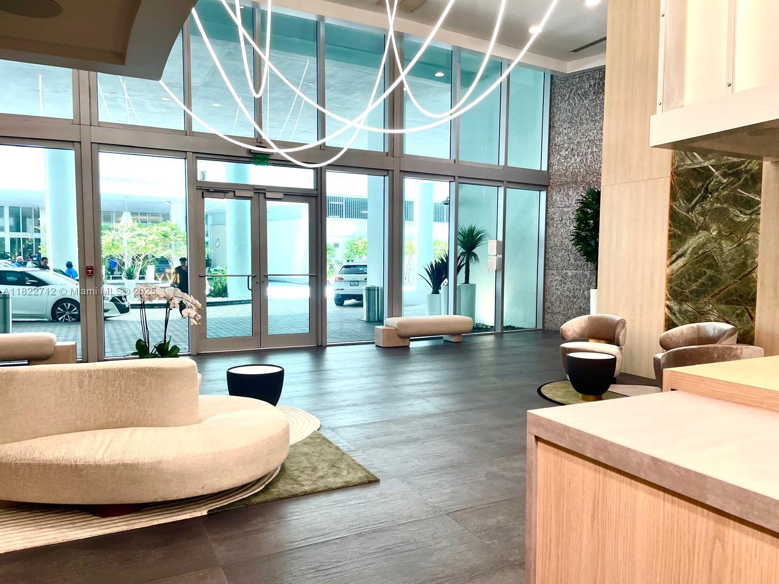 90 Southwest 3rd Street, Unit 3010 Miami, FL 33130 - Photo 23 of 44 a living room with furniture and large windows