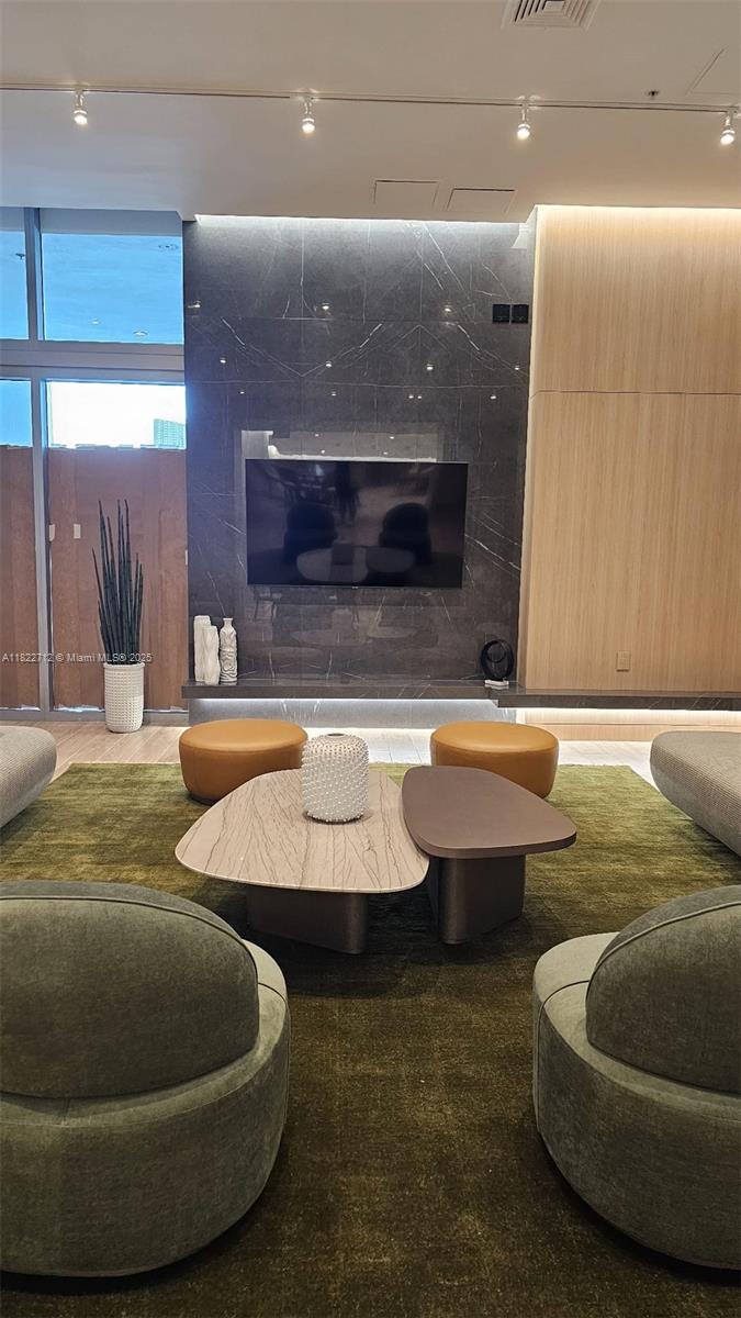 90 Southwest 3rd Street, Unit 3010 Miami, FL 33130 - Photo 29 of 44 a living room with couches and a pool