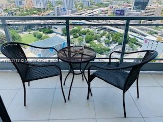 90 Southwest 3rd Street, Unit 3010 Miami, FL 33130 - Photo 3 of 44 a view of a chairs and table in patio