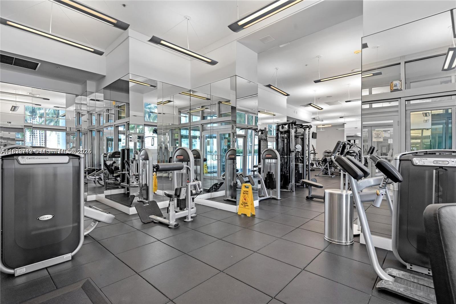 90 Southwest 3rd Street, Unit 3010 Miami, FL 33130 - Photo 32 of 44 a view of a room with gym equipment