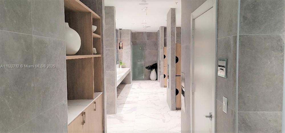 90 Southwest 3rd Street, Unit 3010 Miami, FL 33130 - Photo 36 of 44 a bathroom with a tub and a shower