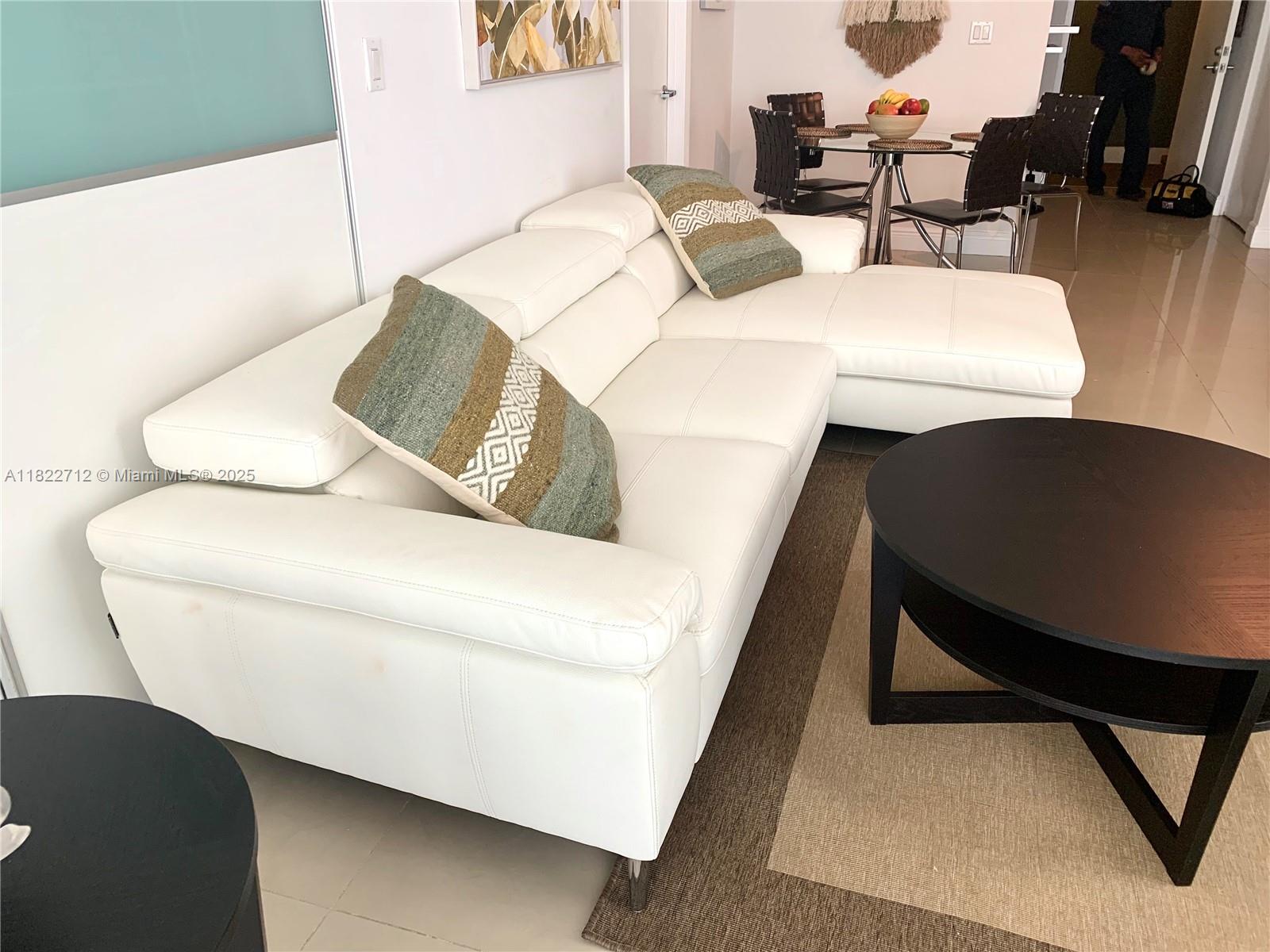 90 Southwest 3rd Street, Unit 3010 Miami, FL 33130 - Photo 8 of 44 a living room with chairs and a couch