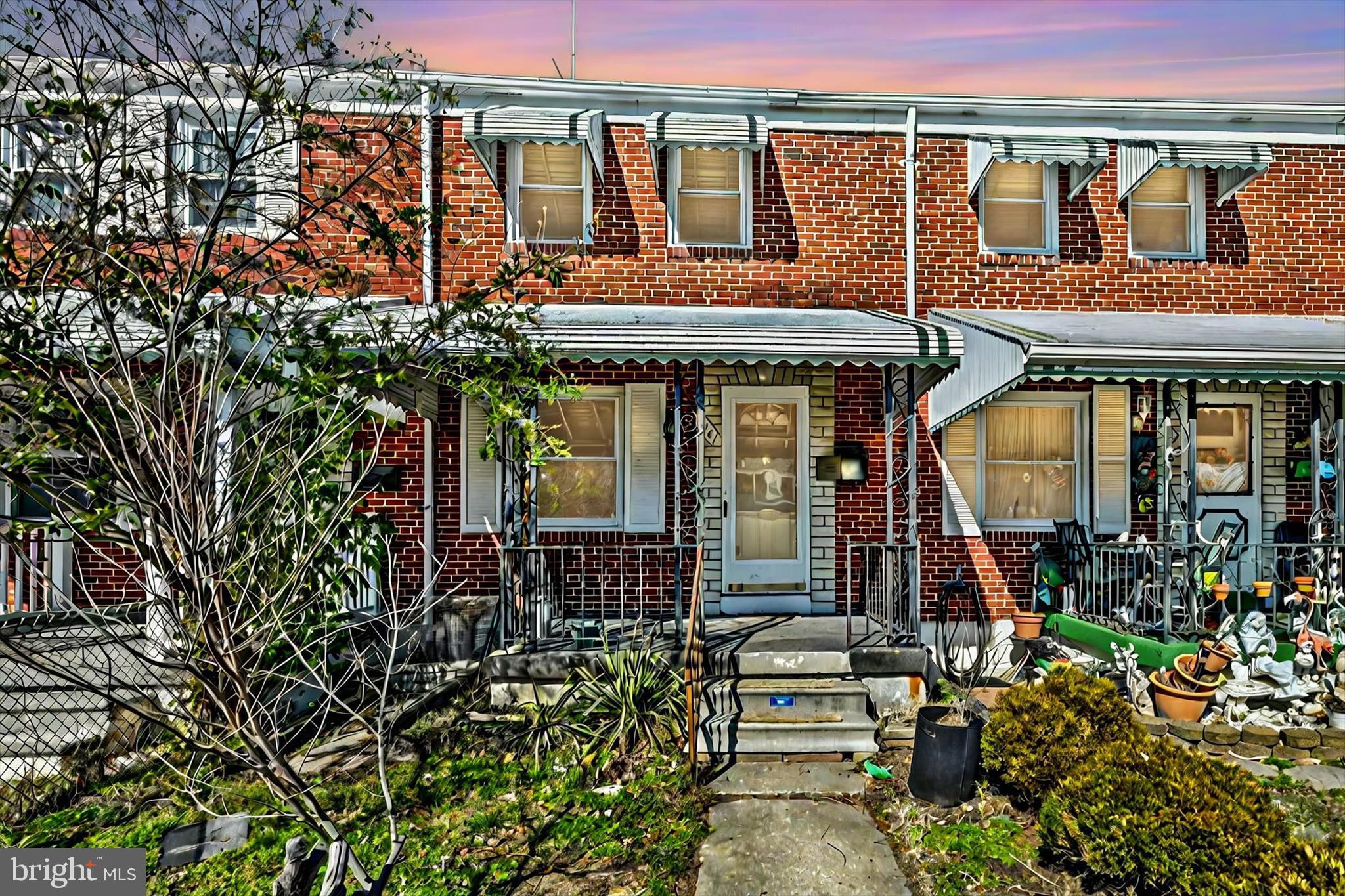 front view of a house with a small garden