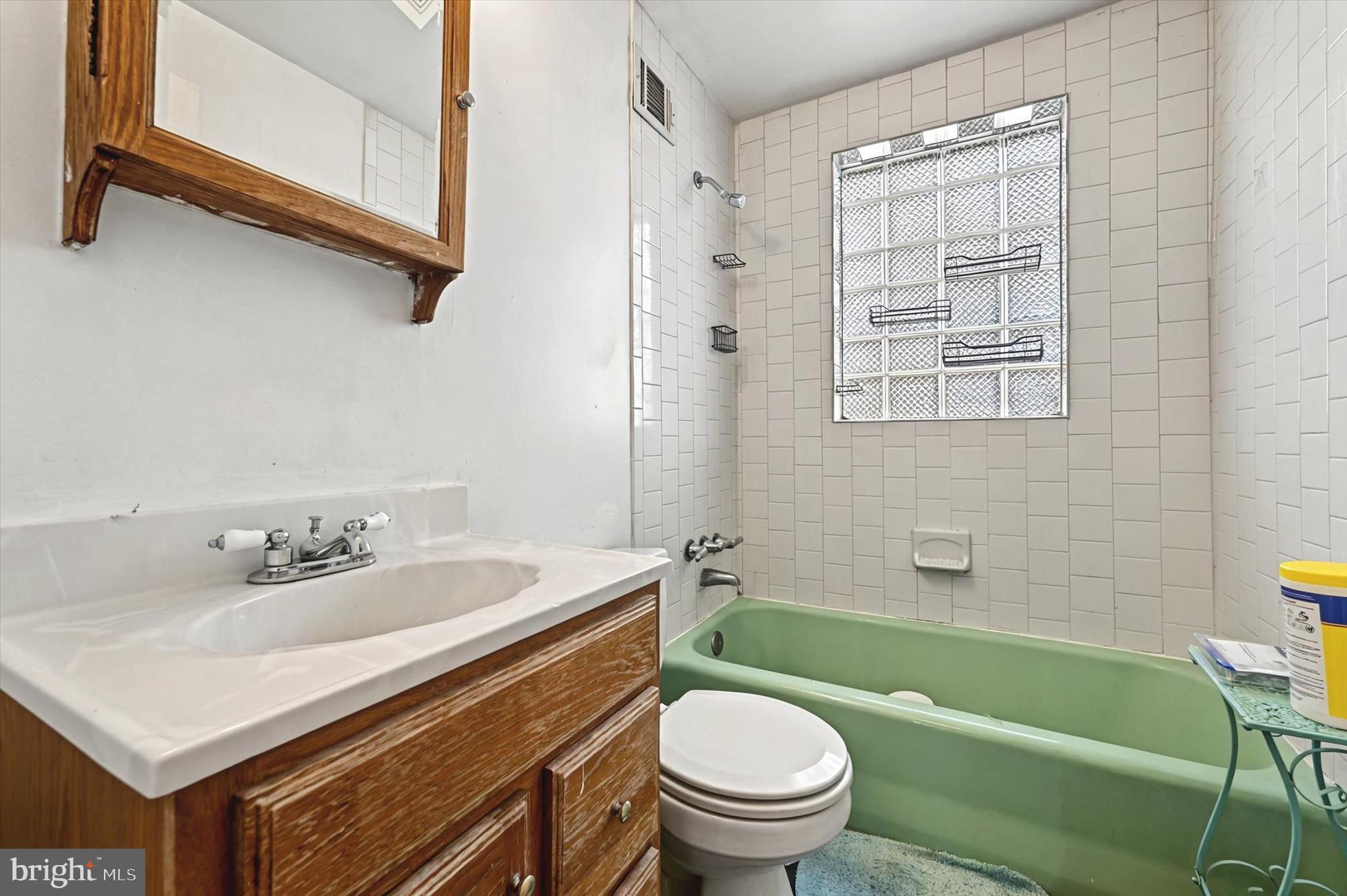 2161 Vailthorn Road Middle River, MD 21220 - Photo 14 of 18 a bathroom with a sink toilet and shower