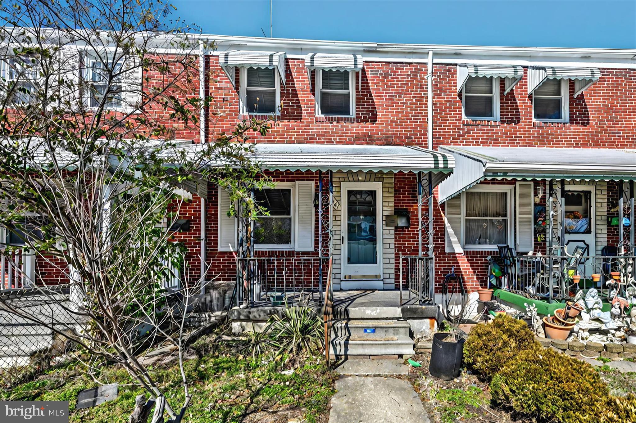 2161 Vailthorn Road Middle River, MD 21220 - Photo 2 of 18 front view of a brick house with a large tree