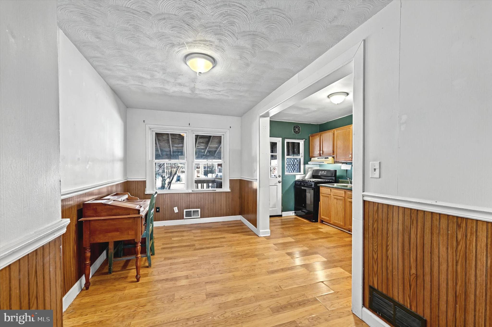 2161 Vailthorn Road Middle River, MD 21220 - Photo 6 of 18 a living room with furniture and a wooden floor