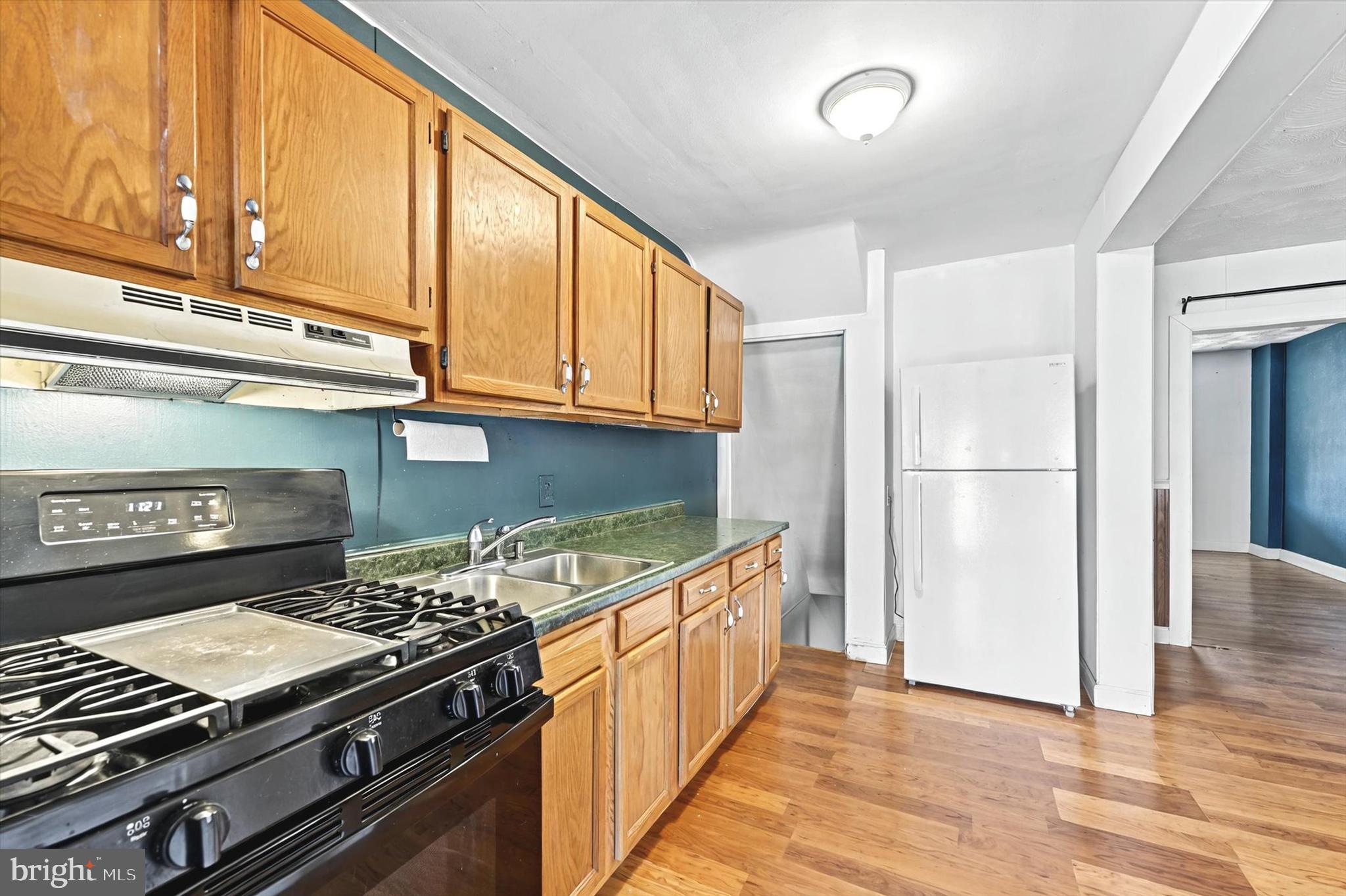 2161 Vailthorn Road Middle River, MD 21220 - Photo 10 of 18 a kitchen with a stove and a refrigerator
