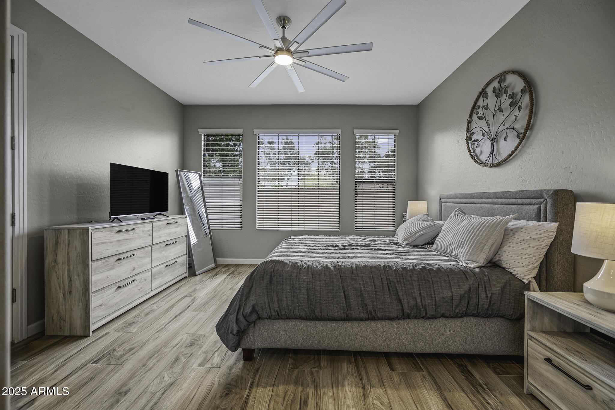 4777 South Fulton Ranch Boulevard, Unit 1044 Chandler, AZ 85248 - Photo 11 of 22 a bedroom with a large bed and a flat screen tv