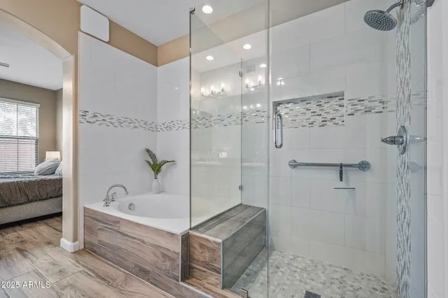 a bathroom with a bathtub and a shower