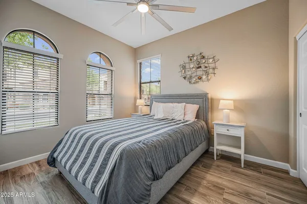 a bedroom with a bed and a window