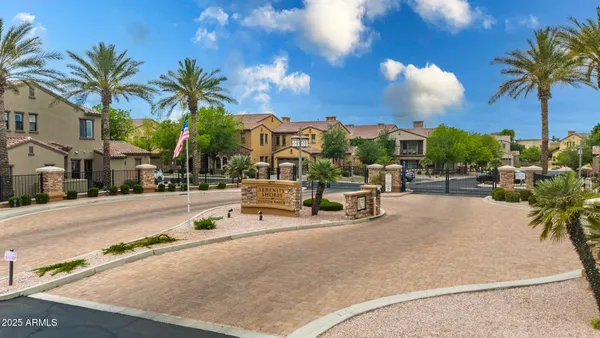 an aerial view of a house swimming pool and a garden