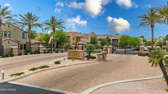 an aerial view of a house swimming pool and a garden