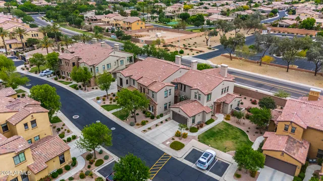 an aerial view of residential houses with outdoor space