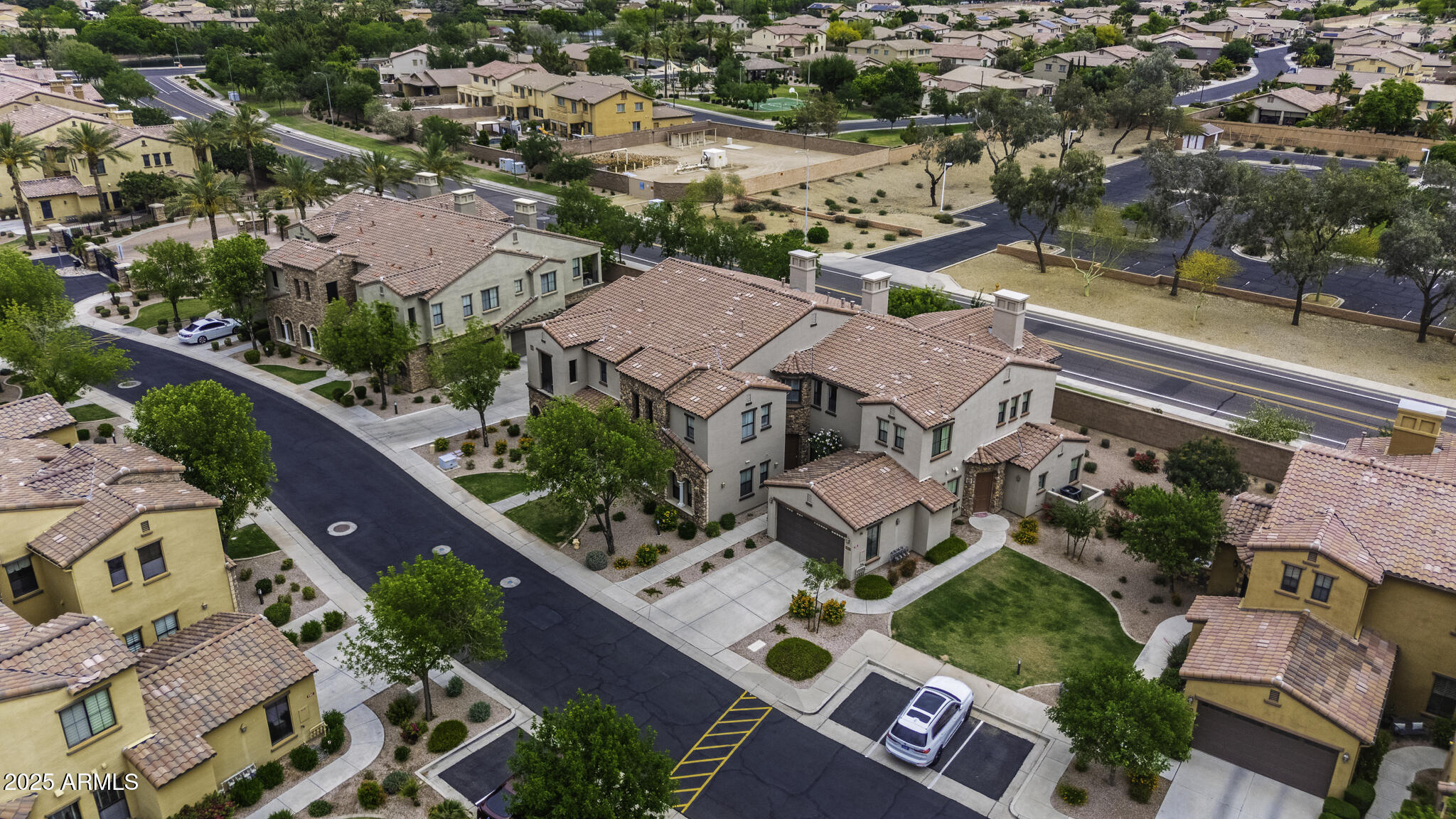 4777 South Fulton Ranch Boulevard, Unit 1044 Chandler, AZ 85248 - Photo 4 of 22 an aerial view of residential houses with outdoor space