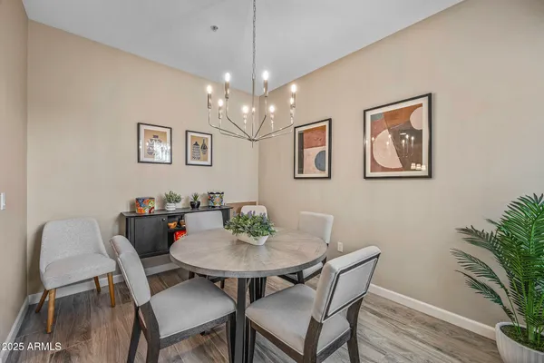 a view of a dining room with furniture and wooden floor