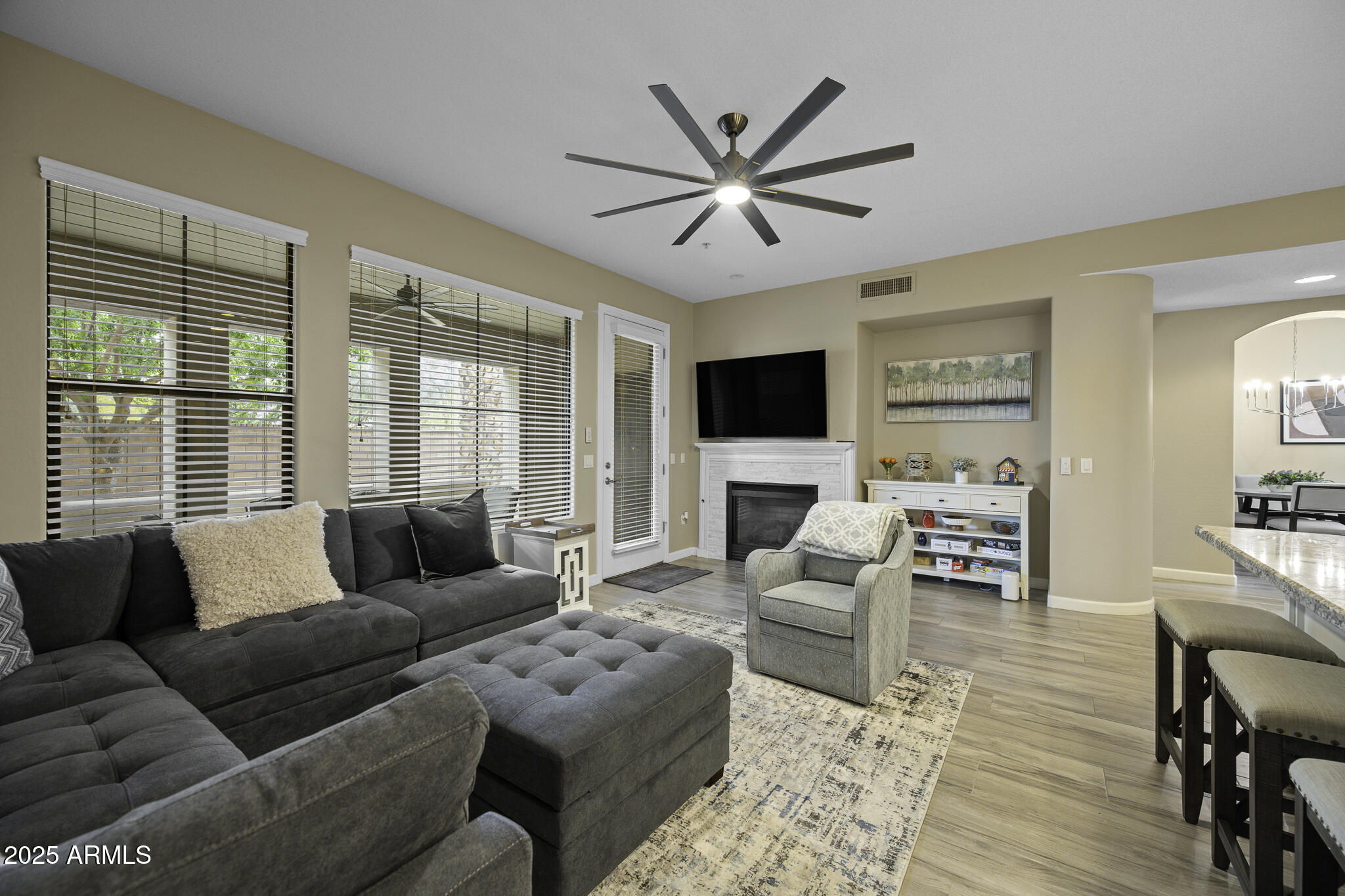 4777 South Fulton Ranch Boulevard, Unit 1044 Chandler, AZ 85248 - Photo 9 of 22 a living room with furniture and a flat screen tv