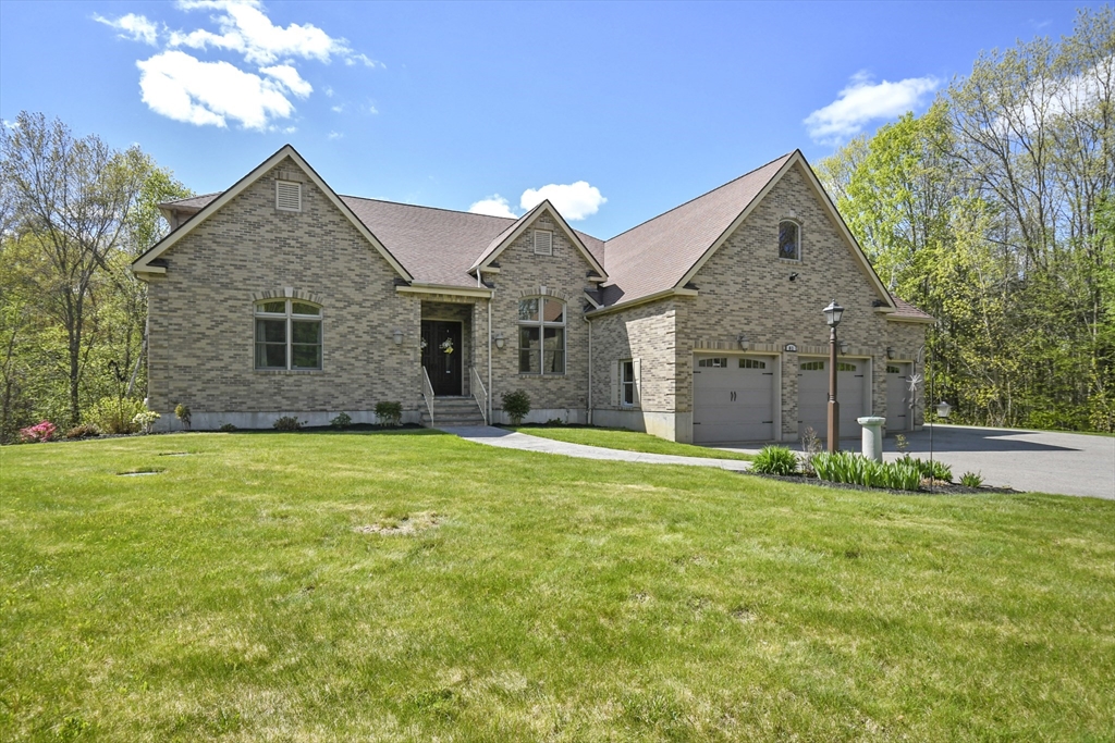 81 Northside Road Charlton, MA 01507 - Photo 3 of 40 a front view of a house with garden