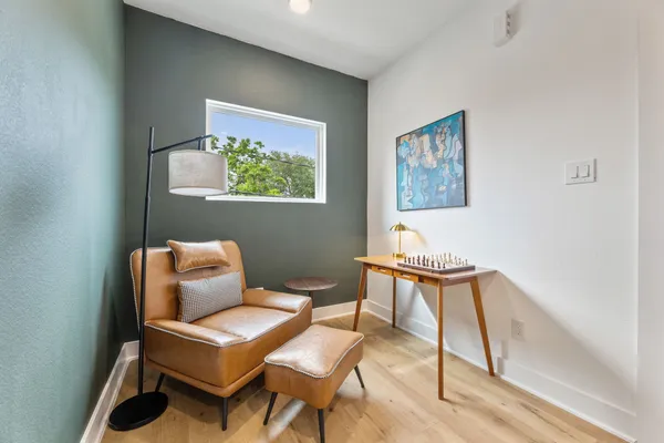 a view of a livingroom with furniture and wooden floor