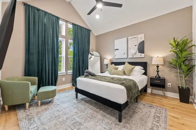 a bedroom with a large bed and a couch