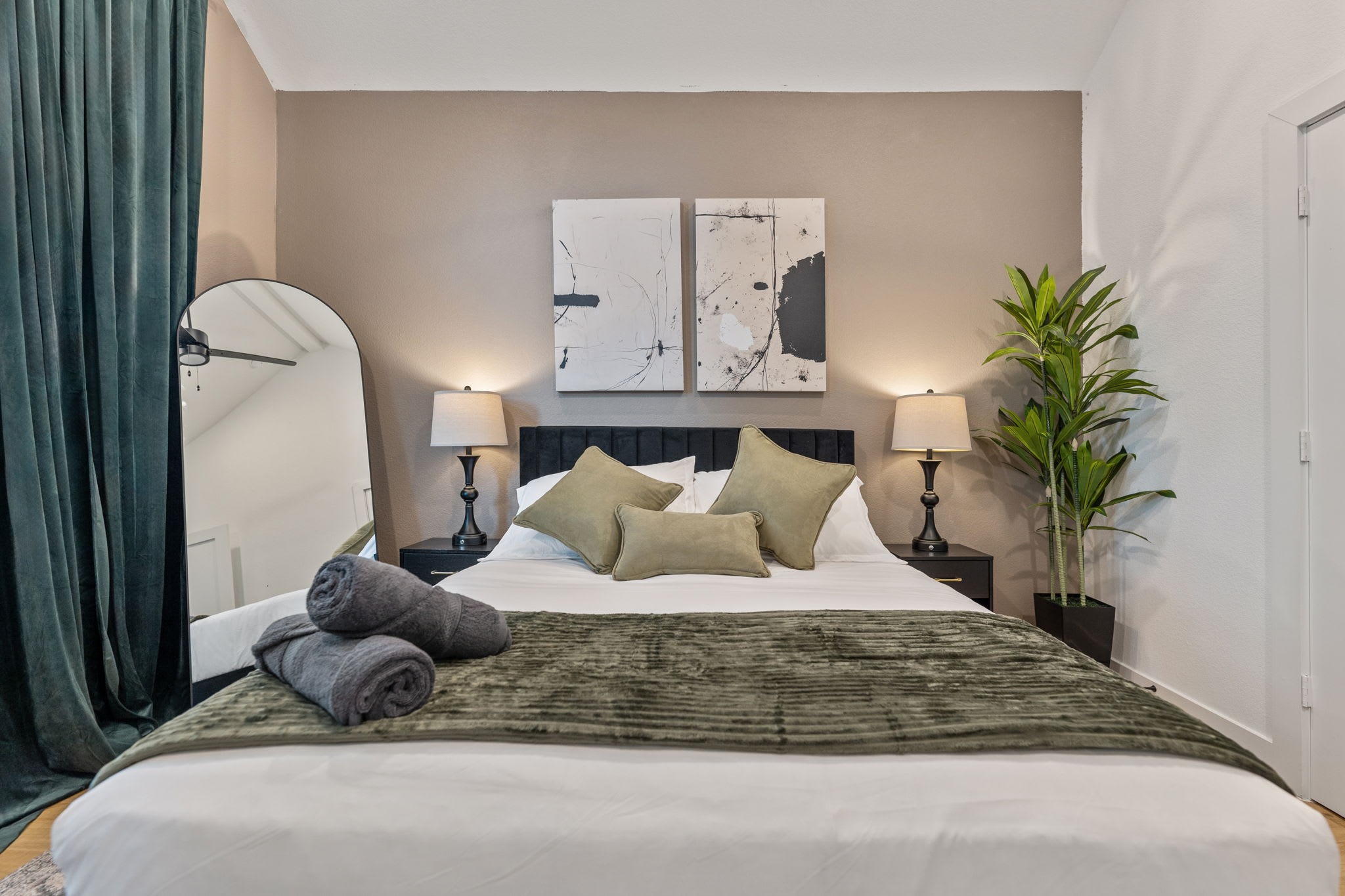 515 Altic Street Houston, TX 77011 - Photo 26 of 36 a bedroom with a bed and a potted plant