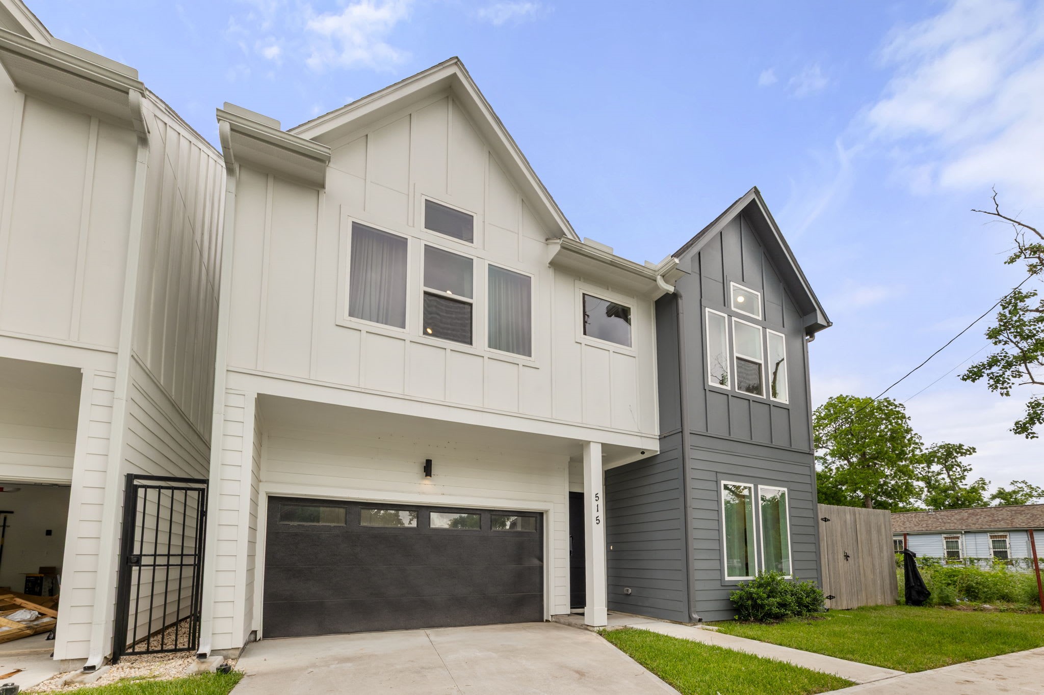 515 Altic Street Houston, TX 77011 - Photo 28 of 36 a front view of a house with a yard and garage