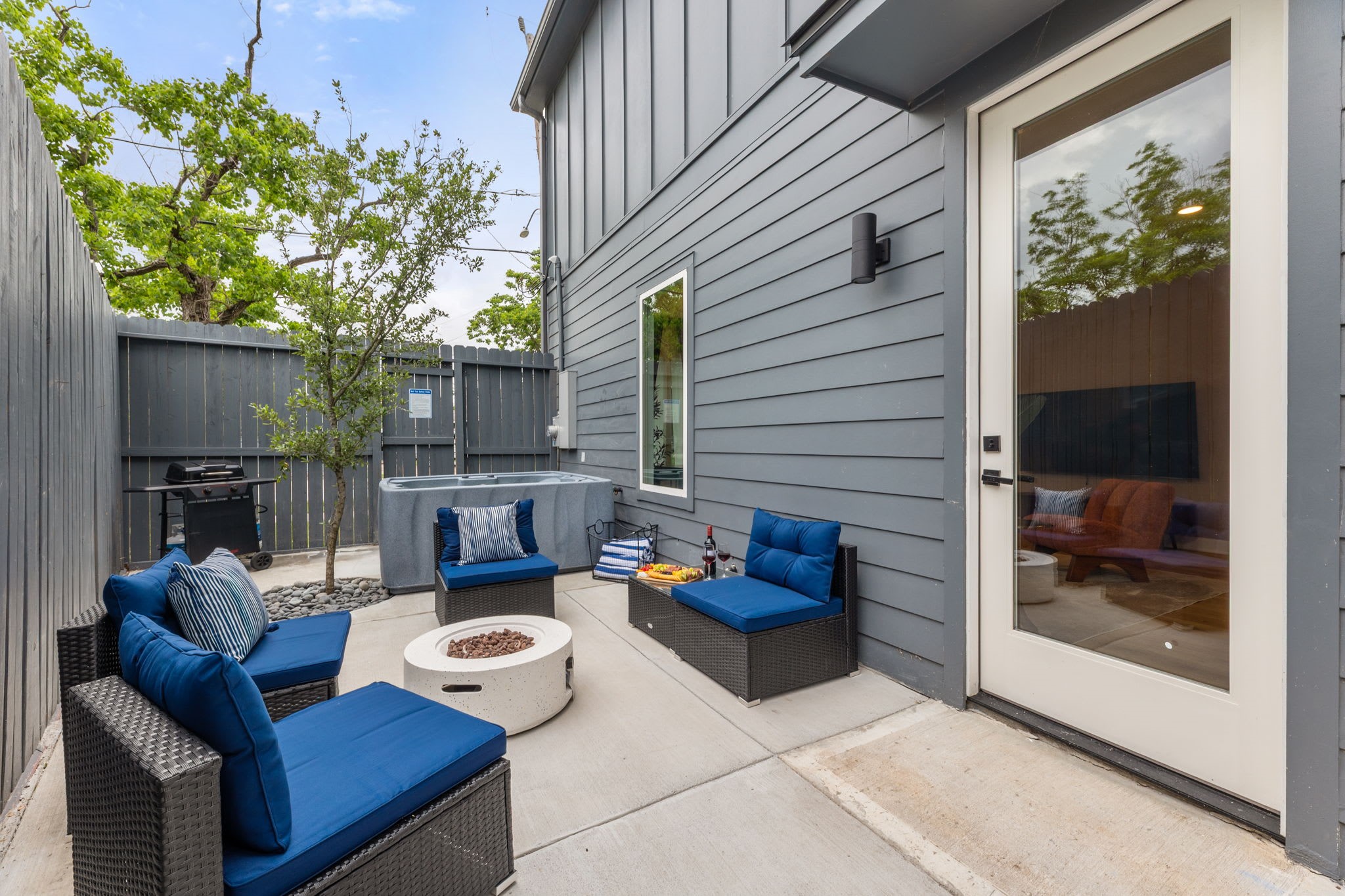 515 Altic Street Houston, TX 77011 - Photo 3 of 36 a view of a deck with couches table and chairs and potted plants