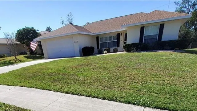 a view of a house with a garden