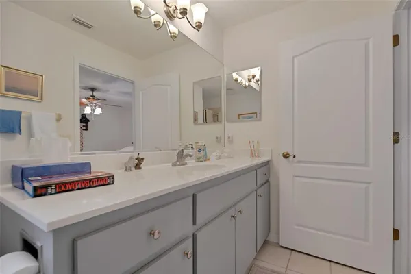 a bathroom with a sink a vanity and a mirror