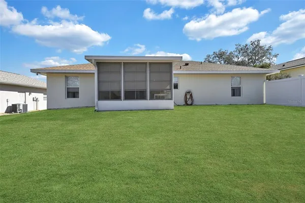 a view of a house with a garden and yard