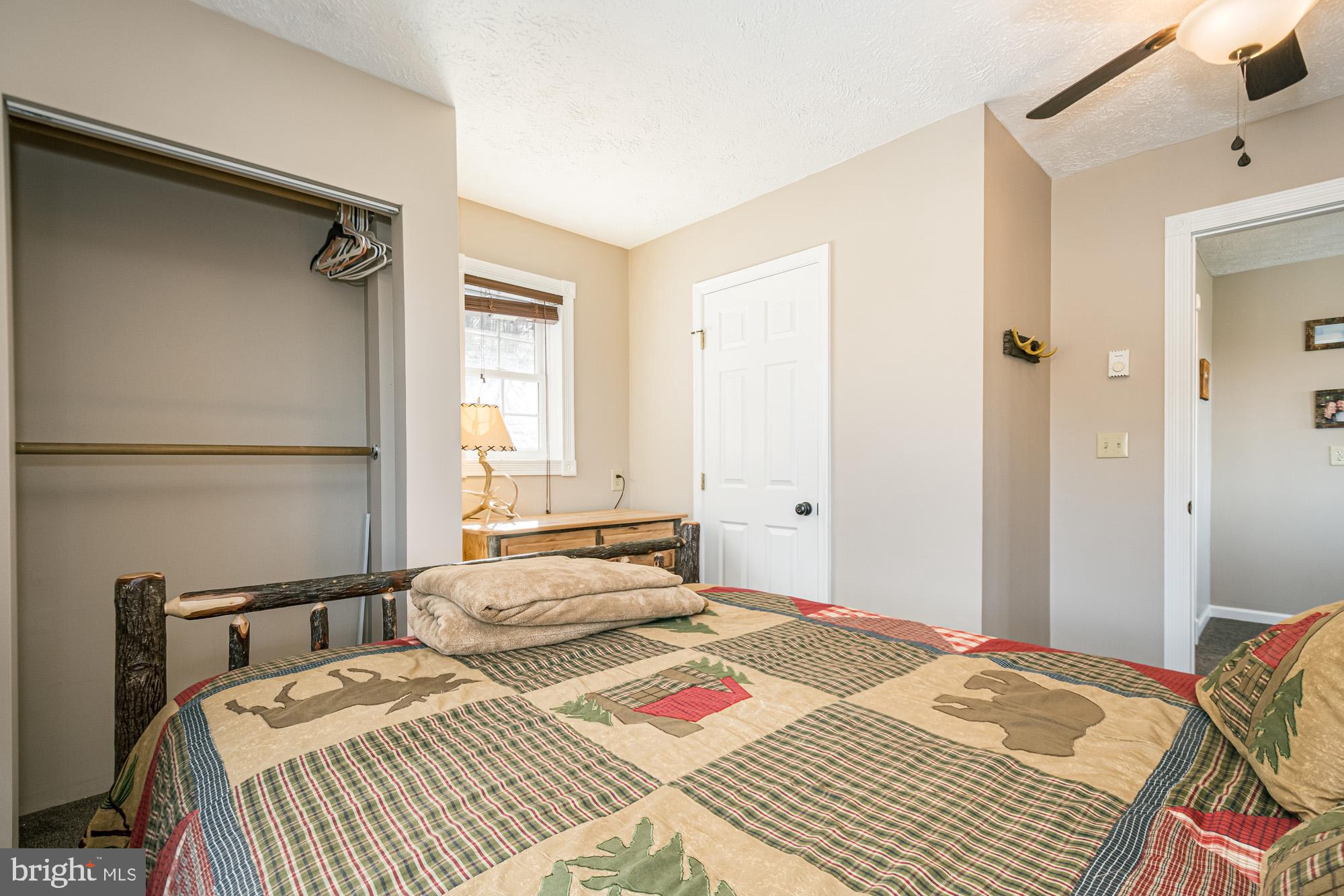 224 Fratz Road Accident, MD 21520 - Photo 39 of 59 a bedroom with a bed and a window