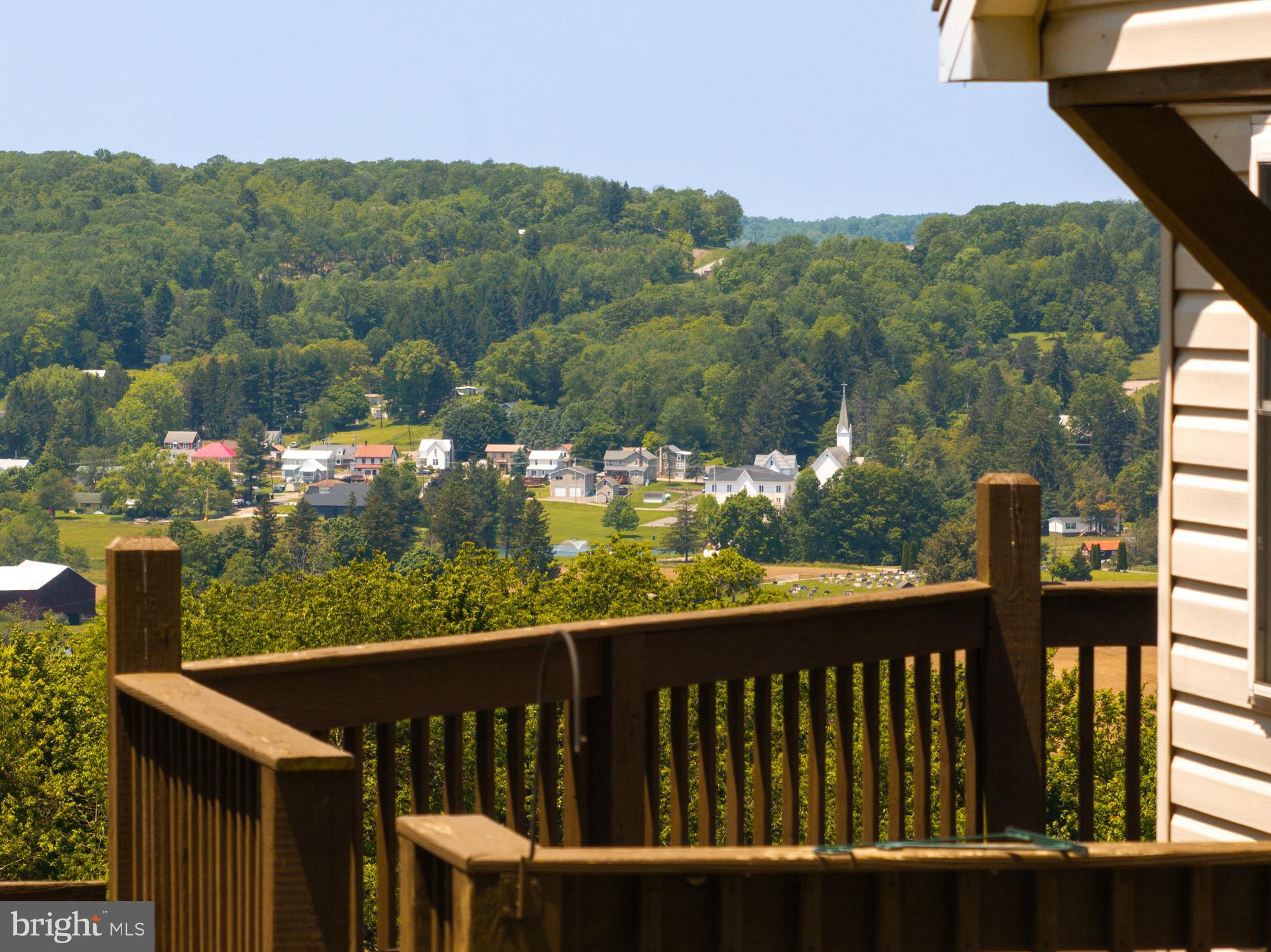 224 Fratz Road Accident, MD 21520 - Photo 6 of 59 a view of a chairs and table in the balcony