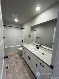 a large room with a lot of counter space and a sink