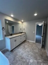 a bathroom with a sink and mirror
