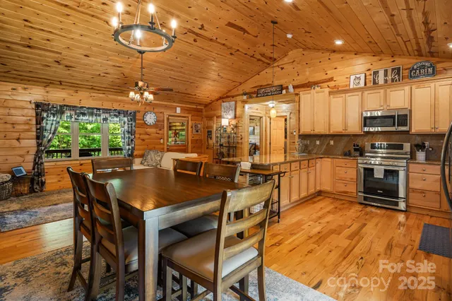 a kitchen with stainless steel appliances a refrigerator sink and microwave